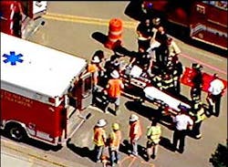 Several injured construction workers could be seen being loaded into ambulances next to the building. Several injured construction workers could be seen being loaded into ambulances next to the building.