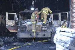 Firefighters work their way down from Engine 733 after clearing smouldering insulation off the roof of the truck Wednesday at Schuylkill Hose Company No. 2, Schuylkill Haven. Flames tore through the company's engine and locker room, destroying two fire engines and a Haz-Mat trailer. Firefighters work their way down from Engine 733 after clearing smouldering insulation off the roof of the truck Wednesday at Schuylkill Hose Company No. 2, Schuylkill Haven. Flames tore through the company's engine and locker room, destroying two fire engines and a Haz-Mat trailer.