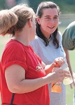 Recovering Hall County Firefighter Angie Roach, right, chats with Malana Parson, left, at Saturday morning's softball tournament fundraiser for the injured firefighter at Laurel Park. Firefighters from Hall County, Gainesville, Oconee County, Alpharetta and Jefferson played in the softball tournament. Recovering Hall County Firefighter Angie Roach, right, chats with Malana Parson, left, at Saturday morning's softball tournament fundraiser for the injured firefighter at Laurel Park. Firefighters from Hall County, Gainesville, Oconee County, Alpharetta and Jefferson played in the softball tournament.