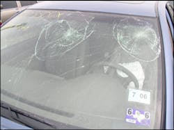 The spider web pattern above the steering wheel indicates the either an unrestrained occupant or a flying object inside the vehicle slammed into the windshield glass. The spider web pattern above the steering wheel indicates the either an unrestrained occupant or a flying object inside the vehicle slammed into the windshield glass.
