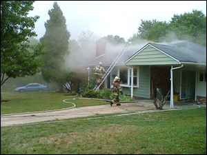 Firefighters operate at a basement fire in a single-family dwelling in Calverton, MD. Crews need to re-evaluate the tactics used in both residential and commercial structures, because these unwanted spaces are being used for living and storage areas.