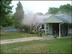Firefighters operate at a basement fire in a single-family dwelling in Calverton, MD. Crews need to re-evaluate the tactics used in both residential and commercial structures, because these unwanted spaces are being used for living and storage areas.
