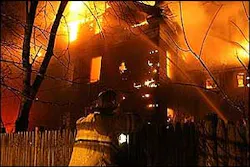 The Somerville officer raced into a three-story duplex engulfed in flames to pull out residents trapped inside.