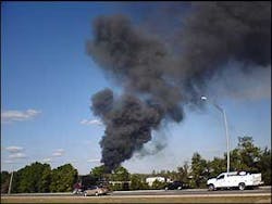 The smoke from an explosion is seen near an industrial building, Dec. 19. The smoke from an explosion is seen near an industrial building, Dec. 19.
