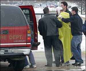 A victim is treated after a shooting on the Northern Illinois University campus.