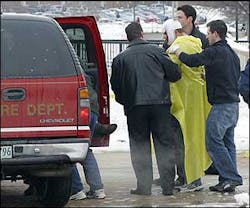 A victim is treated after a shooting on the Northern Illinois University campus. A victim is treated after a shooting on the Northern Illinois University campus.