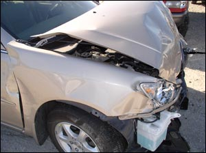 Your decision has been made to attack those exposed hinges and let's lay this thing forward. Cut this hinge then cut the hinge on the driver's side and we're done.