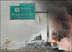 A firefighter works at the scene of an accident involving a fuel tanker truck that left the roadway and caught fire after a crash on Interstate 91, March 28. A firefighter works at the scene of an accident involving a fuel tanker truck that left the roadway and caught fire after a crash on Interstate 91, March 28.