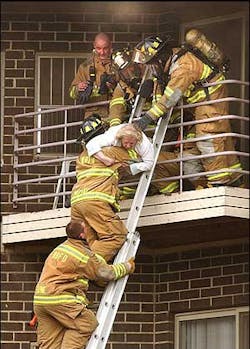 Firefighters rescue an elderly resident from a smoke filled third floor balcony at the Lillian Firefighters rescue an elderly resident from a smoke filled third floor balcony at the Lillian