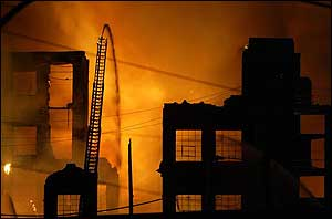 Firefighters battle a seven alarm fire in a warehouse located on Adams Ave. in the Juniata Park section of Philadelphia, April 21.