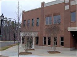 Provided that you pre-plan the new construction in your district, you would know that this building is constructed of wood framing with a brick facade. Provided that you pre-plan the new construction in your district, you would know that this building is constructed of wood framing with a brick facade.