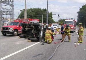 Firefighter Chris Hickman lifted the SUV about 12 inches off the ground, allowing other firefighters to free the driver's arm.