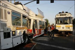 Emergency responders walk between the wreckage after a Metro Blue Line train collided with an out-of-service bus near downtown Los Angeles, Sept. 19. Emergency responders walk between the wreckage after a Metro Blue Line train collided with an out-of-service bus near downtown Los Angeles, Sept. 19.