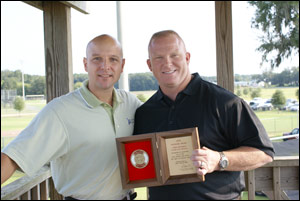 Liberty Mutual's Chris Kent (left) and Ocala Firefighter Chris Hickman with the Firemark award.