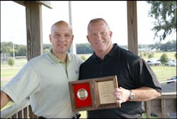 Liberty Mutual's Chris Kent (left) and Ocala Firefighter Chris Hickman with the Firemark award. Liberty Mutual's Chris Kent (left) and Ocala Firefighter Chris Hickman with the Firemark award.
