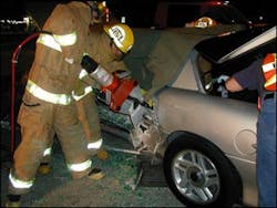 Using the spreader as a squeezer, the operator actually pried the upper edge of the door down enough to create a purchase point for a second, successful attempt with the spreader. Using the spreader as a squeezer, the operator actually pried the upper edge of the door down enough to create a purchase point for a second, successful attempt with the spreader.