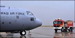 Iraqi air force firefighters respond to a simulated fire in the cargo hold of a C-130 Herculese transport aircraft.