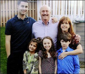 Robert Ryan, center, poses with his wife Kathleen and their four children.