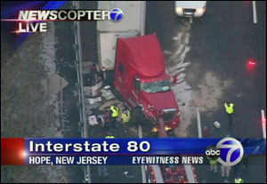 Four New Jersey State Police troopers escaped serious injury when a tractor-trailer plowed into their accident scene.