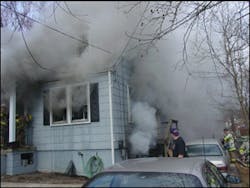 Photo 4 - Though conditions clearly exist on the first floor at this fire, the presence of any smoke from the basement (look at the A-D corner) should attract immediate attention.