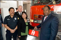 Nancy Howe, widow of the late Los Angeles County Firefighter Jim Howe, center, beams with pride as Engine 216 is renumbered to Engine 9 in honor of her late husband. Howe is joined by (l-r) Supervising Fire Dispatcher Al Jackson, Los Angeles County Fire Chief P. Michael Freeman and Second District County Supervisor Mark Ridley-Thomas at Los Angeles County Fire Station 16 in the City of Inglewood in South Los Angeles, where Jim Howe served most of his career.