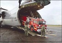 The old Hazel Park fire engine is unloaded Jan. 26 from the nose of a C5-A cargo plane at the San Isidro Air Force Base outside Santo Domingo in the Dominican Republic. The old Hazel Park fire engine is unloaded Jan. 26 from the nose of a C5-A cargo plane at the San Isidro Air Force Base outside Santo Domingo in the Dominican Republic.
