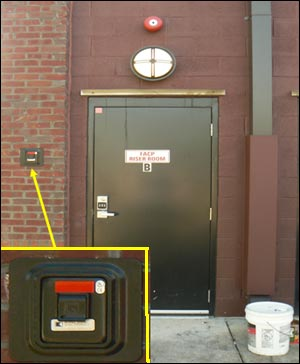 An exterior key vault has been installed beside a fire protection equipment room door to provide keys to firefighters for the facility.
