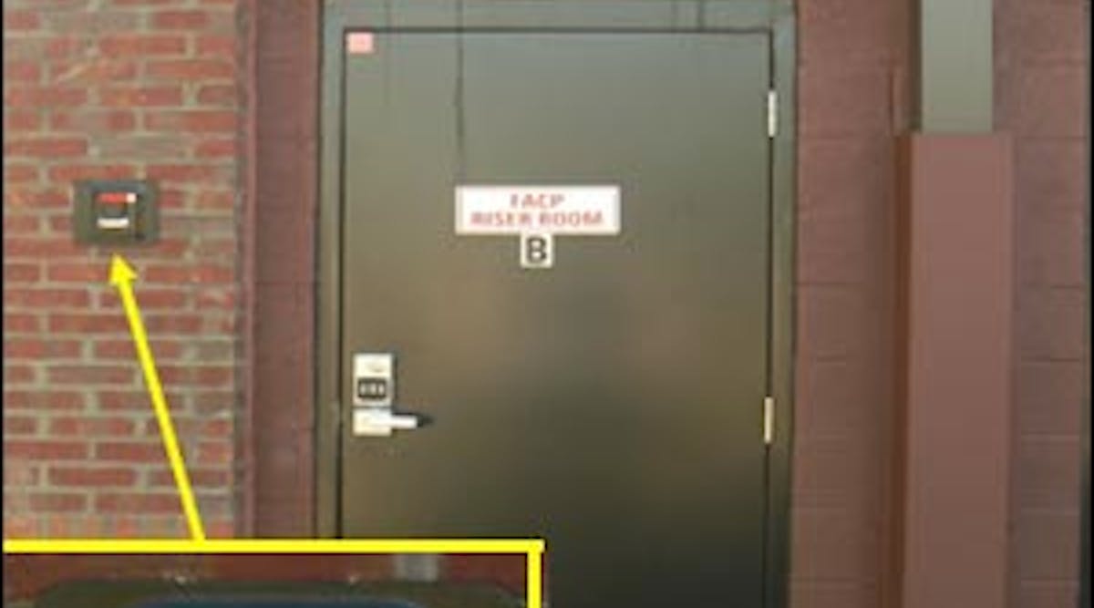 An exterior key vault has been installed beside a fire protection equipment room door to provide keys to firefighters for the facility.