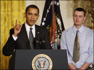 President Barack Obama, accompanied by firefighter Travis Ulerick delivers remarks at the White House Forum on Health Reform.