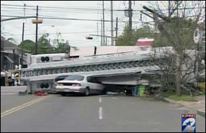 The ladder truck then rolled, hit a woman on a bicycle, snapped an electric pole and came to rest on top of a car.