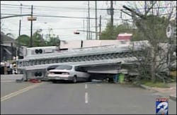 The ladder truck then rolled, hit a woman on a bicycle, snapped an electric pole and came to rest on top of a car. The ladder truck then rolled, hit a woman on a bicycle, snapped an electric pole and came to rest on top of a car.