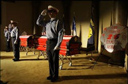Houston Fire Department honor guard members Deena Elliott of Station 51, James Wathen of Station 15, and Chris Hamrick of Station 47, from left, salute before a public viewing for firefighters Capt. James Harlow and Damion Hobbs at Grace Community Church.