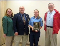 Rush Fire Department President Diana Pfersick, Post Advisor Royer Pfersick, Explorer Jenna Cirincione and Al Sweet - FASNY Youth in the Fire Service Committee and winner of Monroe County Volunteer Firefighter Association&apos;s Distinguished Service Firefighter of the Year for 2009.