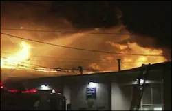 The blaze grew quickly from one alarm to three alarms as 135 firefighters fought it. The blaze grew quickly from one alarm to three alarms as 135 firefighters fought it.