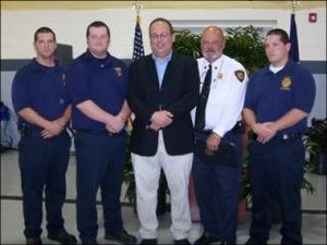 Jim Moore, in the white shirt, with sons Jonathan, Mike and Jeremy and reporter Dave Statter in the middle.