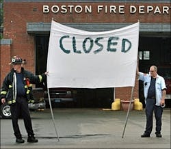 Boston firefighters picket at the Neponset Ave. station, one of three firehouses where fire apparatus have been put out of service due to budget shortfalls.