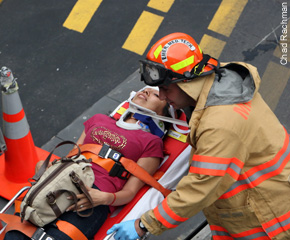A young victim is treated for injuries following the Wednesday, July 1 Staten Island ferry crash.