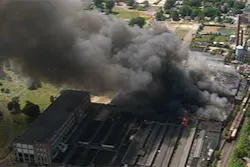 Dozens of firefighters worked throughout the night Friday to put out smoke and flames at the former Rock Hill Printing and Finishing Company.