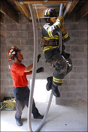 A firefighter participates in a hands-on training class at Rockville, Md. in 2007.