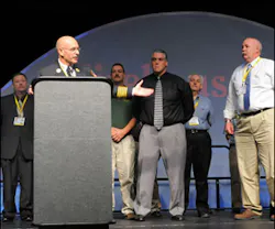 FDNY Chief Sal Cassano recognizes Firehouse Expo presenters at the end of the opening ceremonies.