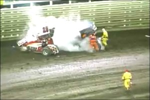 Firefighters pulled a man from a burning sprint car Saturday at the Knoxville Raceway as thousands of fans watched.