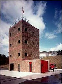 The drill tower and training ground. The rear of the station is visible on the hill.Photos by Chief Kenny Lane