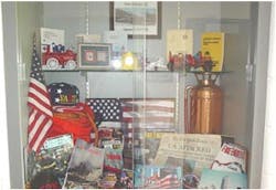 This is the display case in the front entrance hallway to Station 15. It holds memorabilia from the September 11th attacks at the Pentagon and the World Trade Center. Our members responded to both locations.Photos by FF/PM Chad Little