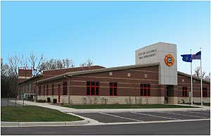 The exterior is brick masonry with six cast stone elements depicting: a Dalmatian dog, firefighter's helmet, ladder and pike pole, fire engine, hydrant, and Memorial Tribute to the Heroes of September 11, 2001. Photos by Deputy Chief Todd Yandre