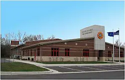 The exterior is brick masonry with six cast stone elements depicting: a Dalmatian dog, firefighter's helmet, ladder and pike pole, fire engine, hydrant, and Memorial Tribute to the Heroes of September 11, 2001. Photos by Deputy Chief Todd Yandre
