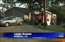 Troopers cited a firefighter after a fire truck went rolling in a Mount Holly home Saturday.