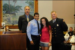 Mayor Rick Baker of St. Petersburg, Eddie Rodriguez, his daughter Sasha Rodriguez and Fire Chief James Large.