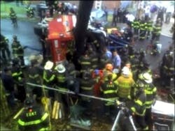 An FDNY engine and ladder truck collided Saturday morning, leaving several firefighters injured and at least two trapped.
