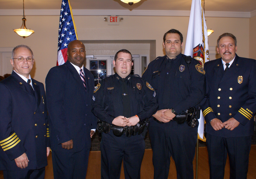 Corporal Joshua Hoffman and Patrolman Sean Young with the Ocala Police Department received recognition for their assistance at a residential structure fire.From left to right are:Fire Deputy Chief Bill Mallory, Police Deputy Chief Rodney Smith, Patrolman Young, Corporal Hoffman, Fire Operations Chief Jim Ganter