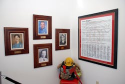 A Team Brian Poster, with signatures from all members of the Amarillo Fire Department hangs on the wall of the station. The three photos memorialize the department's four line of duty deaths, including Brian Hunton, who is top center. A Team Brian Poster, with signatures from all members of the Amarillo Fire Department hangs on the wall of the station. The three photos memorialize the department's four line of duty deaths, including Brian Hunton, who is top center.
